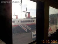 Grabbing the forward section of skirt, at the point where it has a hole to enable the vehicle bow ramp to lower fully